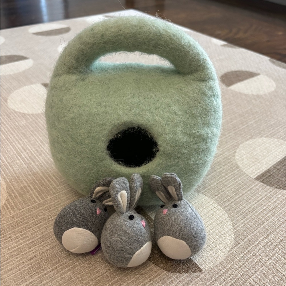 Lovevery bunnies in a felt burrow